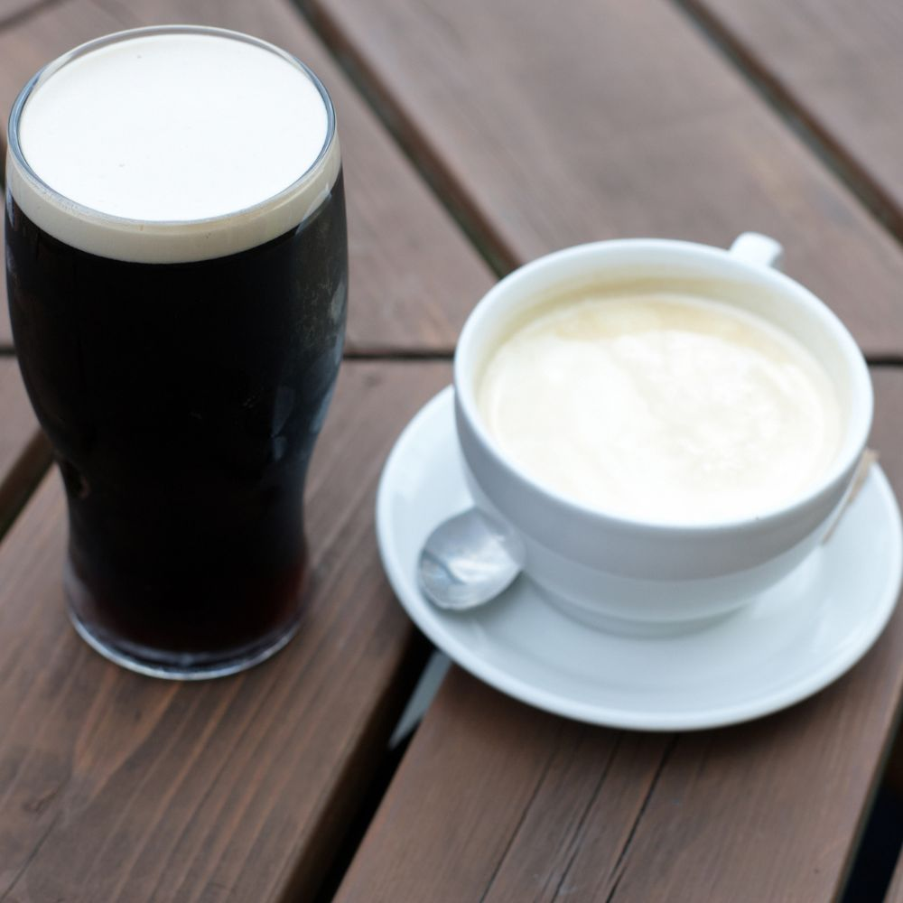 A glass of beer and a cup of coffee, illustrating the guidelines for alcohol and caffeine consumption while taking semaglutide