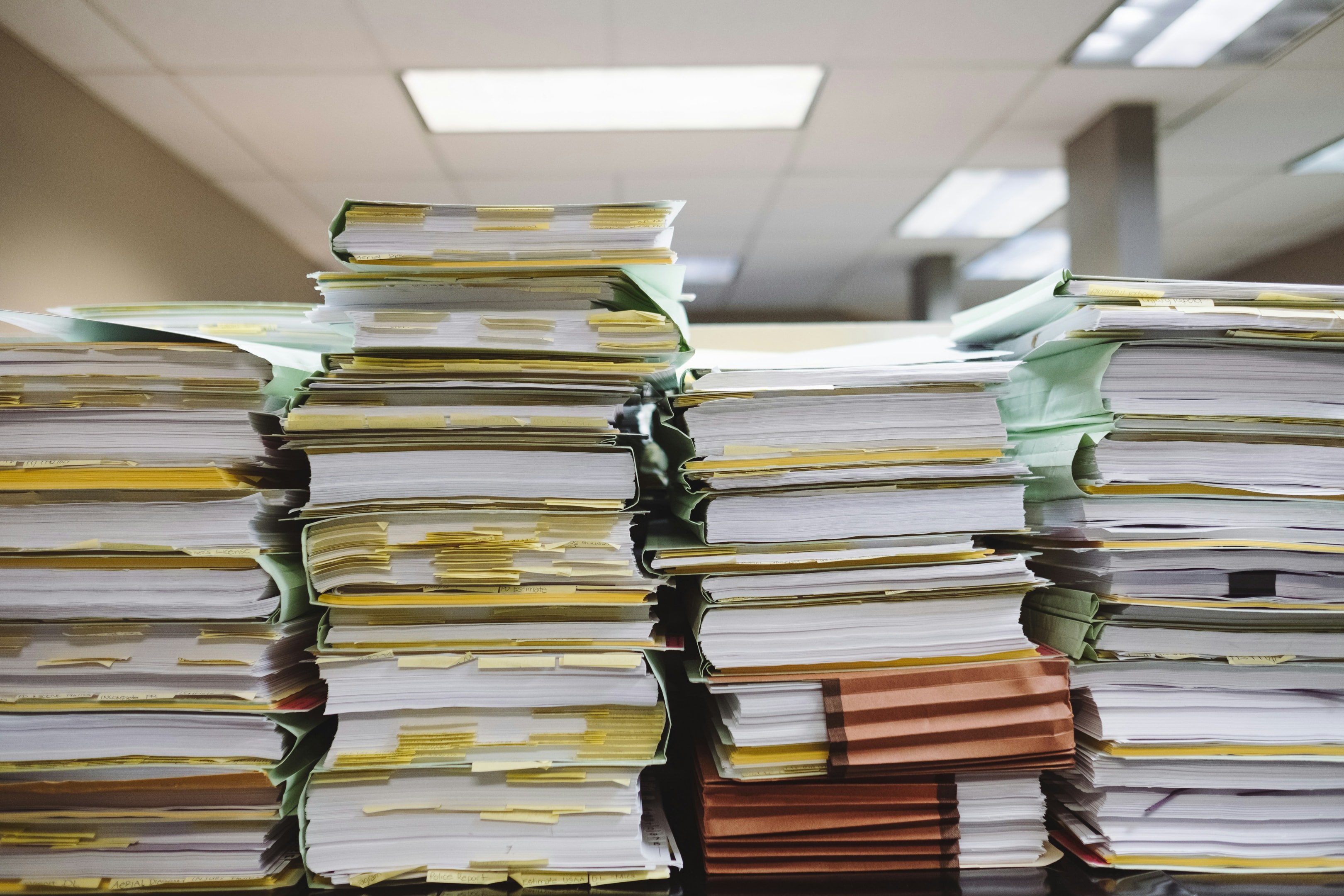 Stacks of paper records at county treasurer's office. 