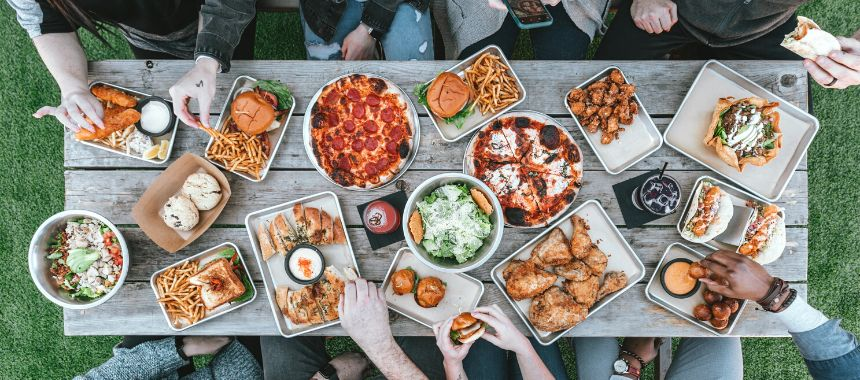 Eating inside a tiny home with friends is challenging. Eat outside instead. Source: Unsplash