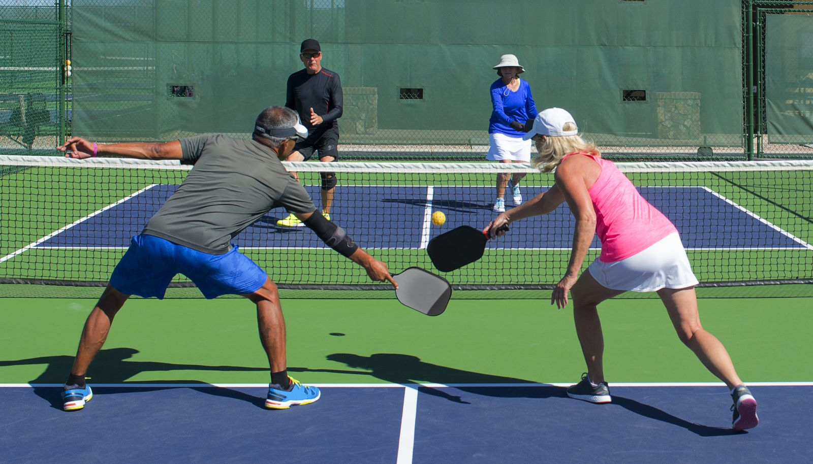 Two players playing pickleball on a court