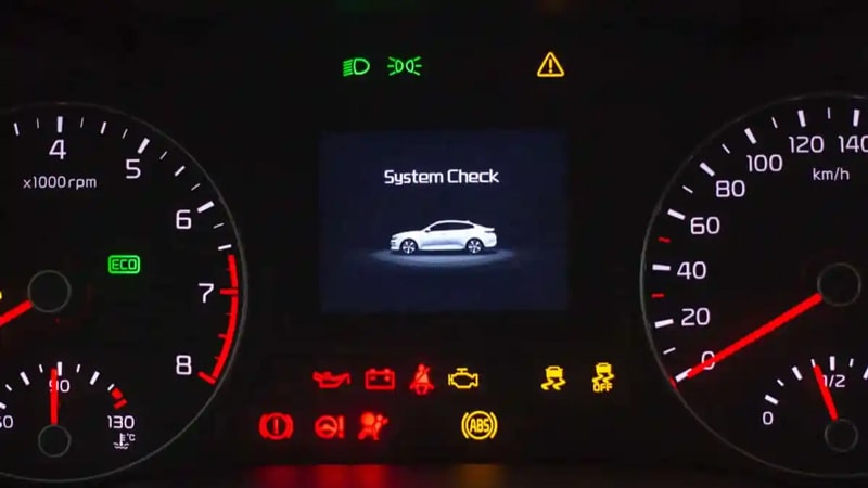 A car dashboard displaying a warning light related to hyper-flashing issues in the turn signals