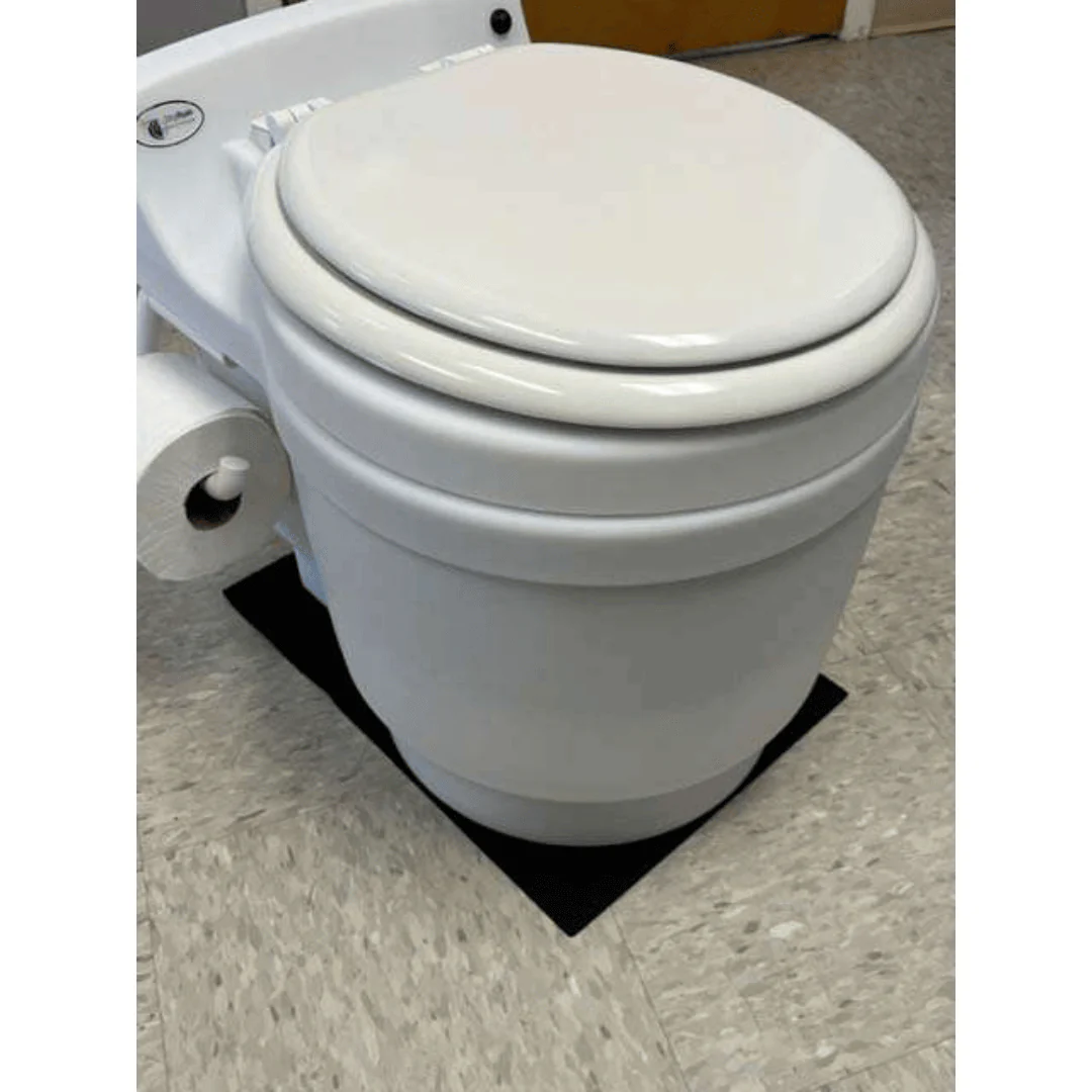 White Laveo Dry Flush Toilet with a Laveo Non-Skid Silicone Toilet Mat