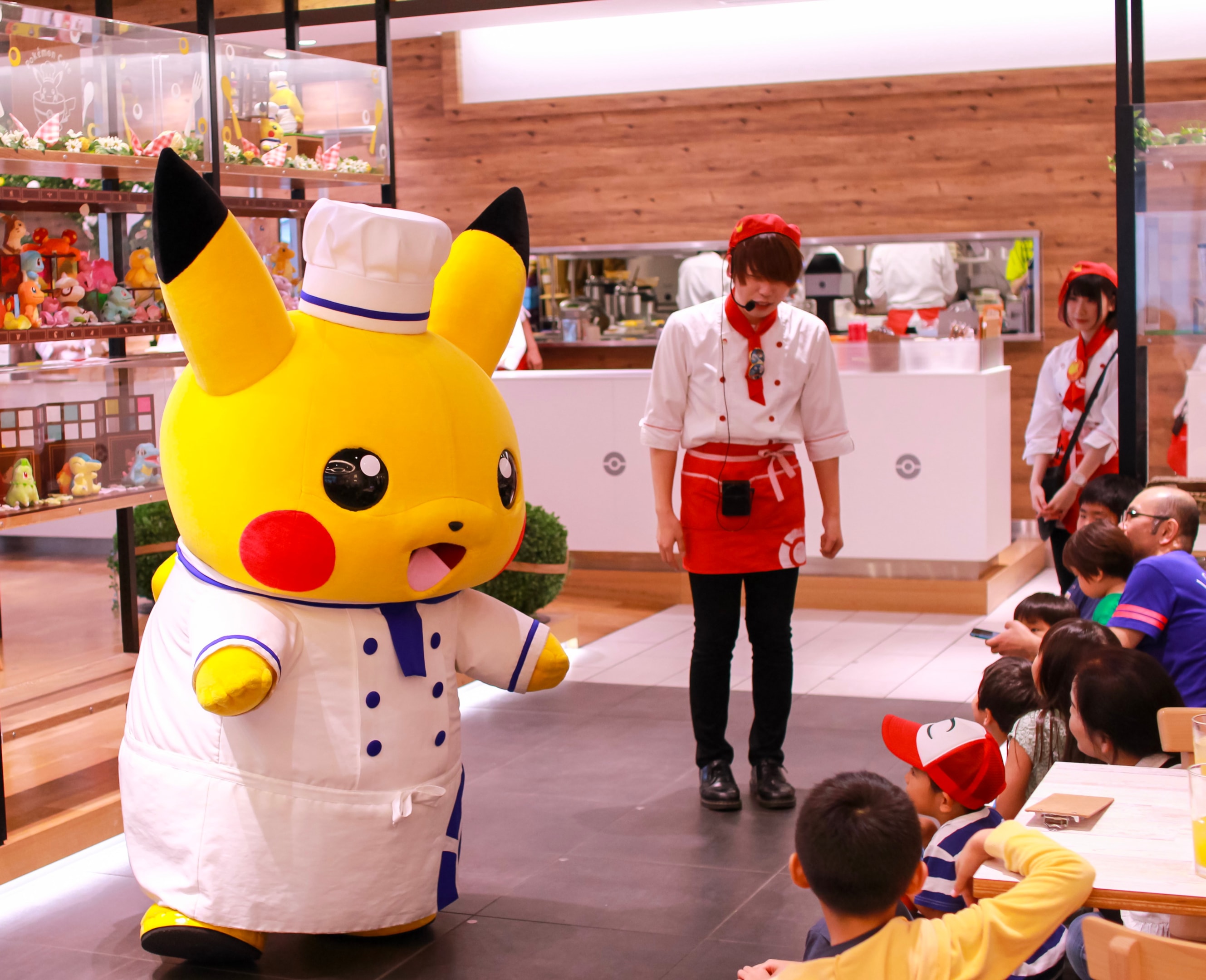 Pokémon Café Tokyo Pikachu mascot performance with kids