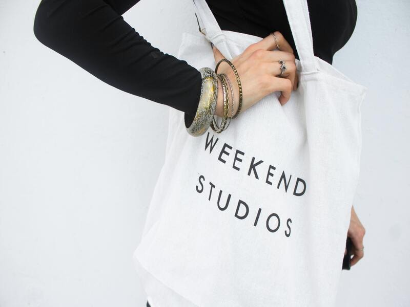 A woman carrying a stylish tote bag. 