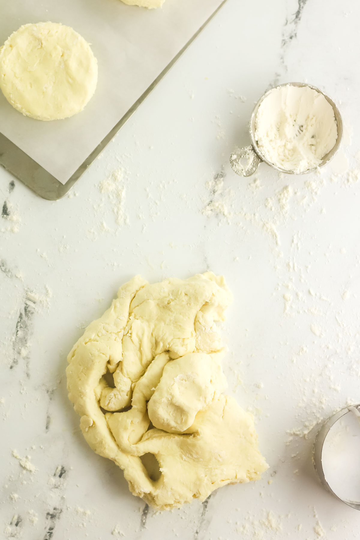 biscuit scrap dough being pressed back together