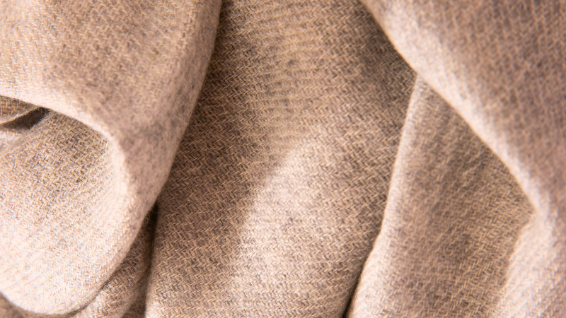 A close-up view of a gray cotton blanket
