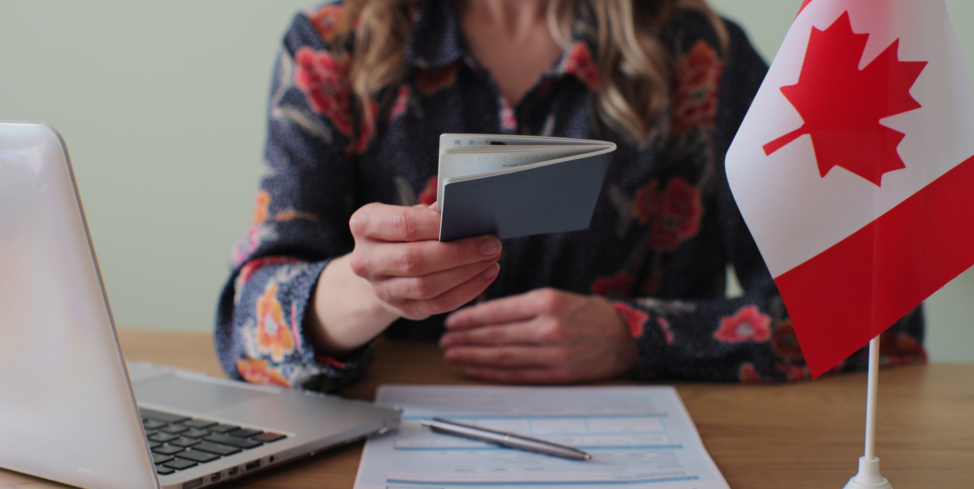 A meeting between a Canadian visa consultant and a client discussing immigration options.