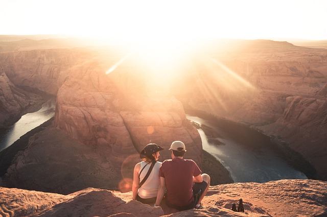 couple, canyon, sunrise, grocery shopping, credit card debt, savings goals