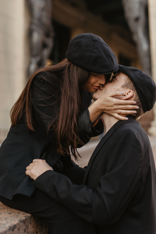 a couple kisses outdoors