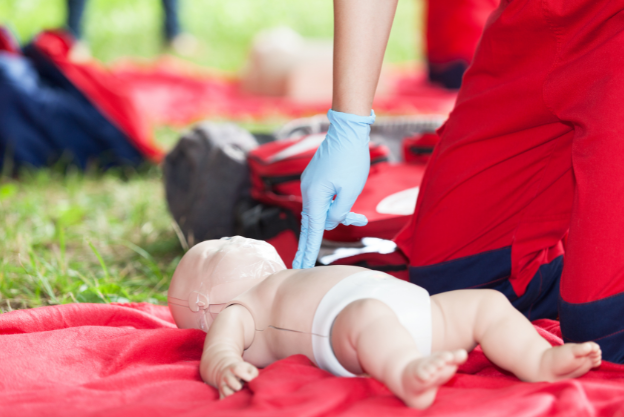 Illustration of infant CPR using two-finger chest compressions