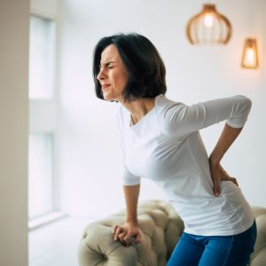 woman suffering from acute lower back pain