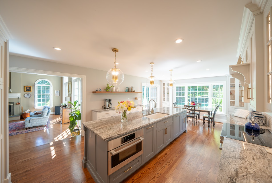 5 Inspiring Open Concept Kitchen Living Room Designs for Every Home 3 Open kitchen with a marble countertop island and pendant light fixtures