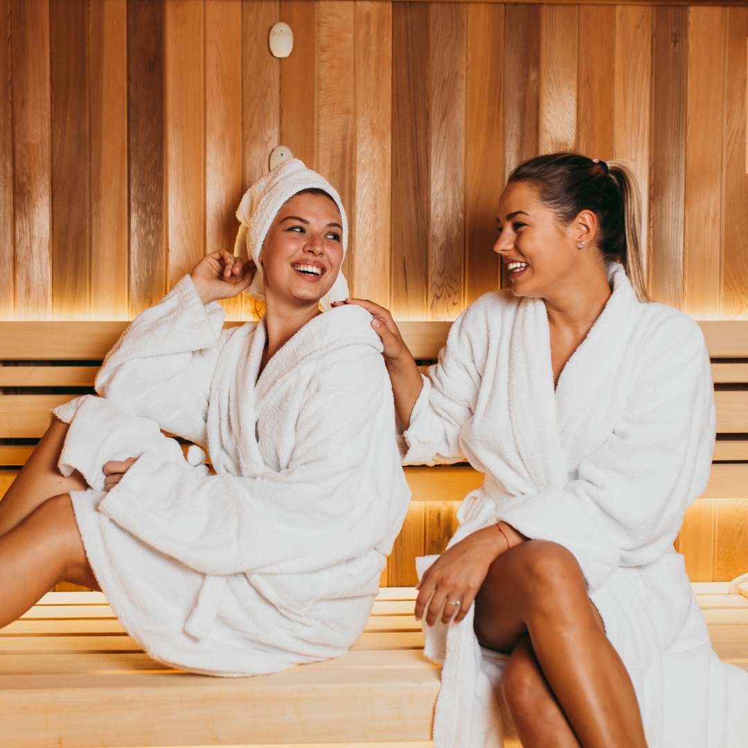 Image of two people illustrating the science behind the connection or saunas and weight loss.