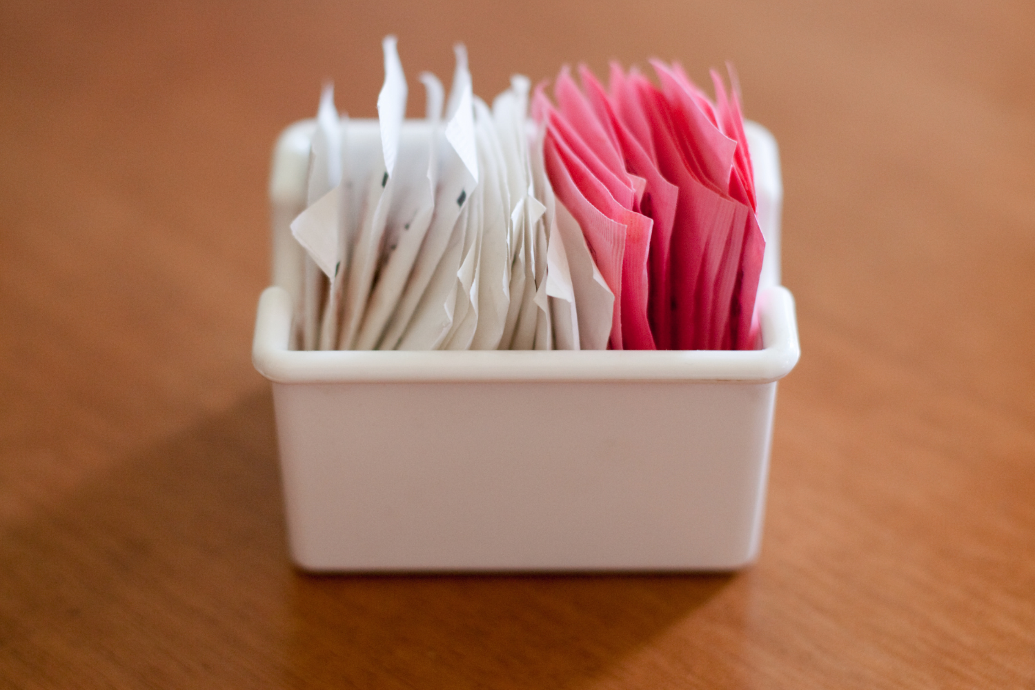 Small container of artificial sweeteners.