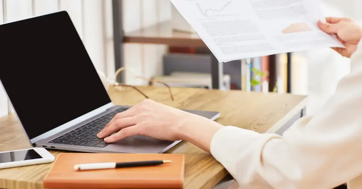 Woman reviewing IRS debt and monthly expenses to understand currently not collectible status.
