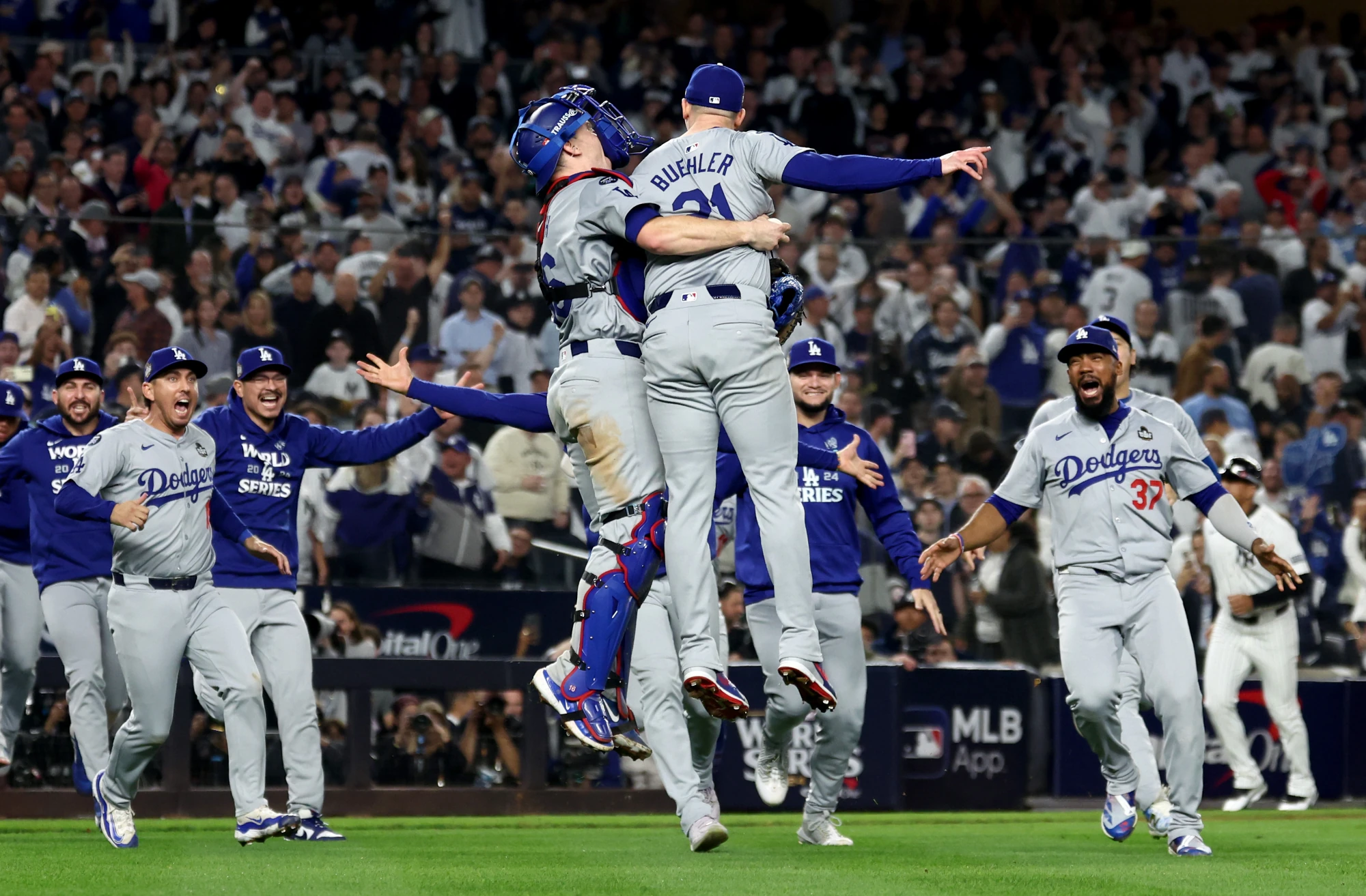 Oct 30, 2024; New York, New York, USA; Los Angeles Dodgers players and coaches celebrate after winning the 2024 MLB World Series against the New York Yankees at Yankee Stadium.
