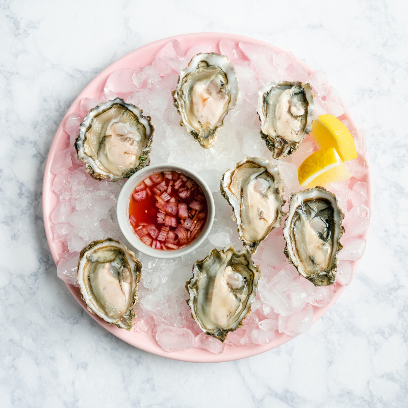 Image displaying oysters served with Classic Mignonette Sauce.