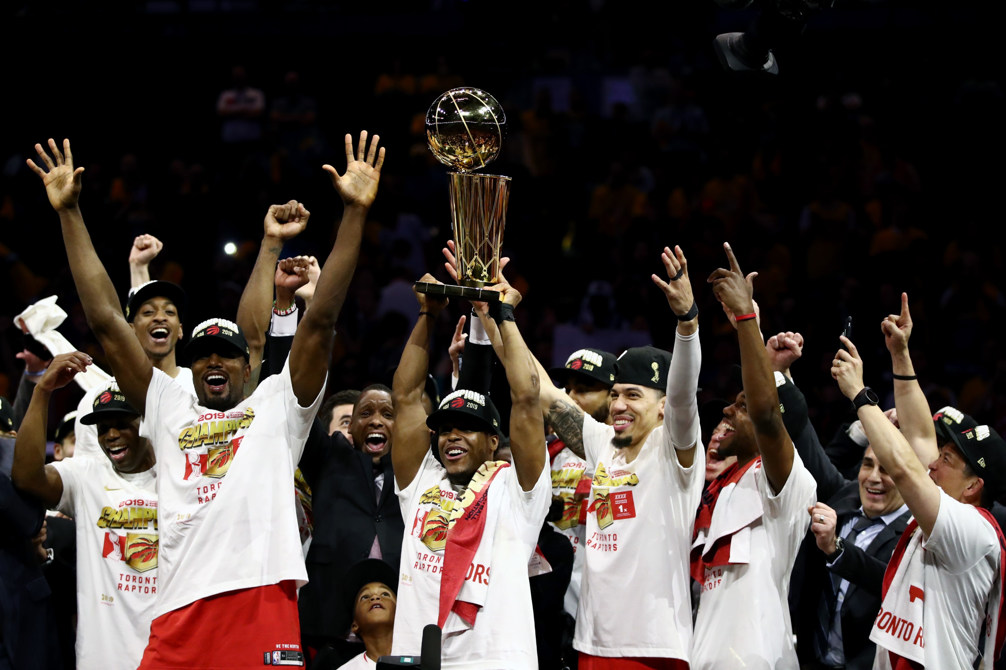 Kawhi Leonard of the Toronto Raptors celebrates with the Larry O'Brien Championship Trophy after his team defeated the Golden State Warriors to win Game Six of the 2019 NBA Finals at ORACLE Arena on June 13, 2019 in Oakland, California. 