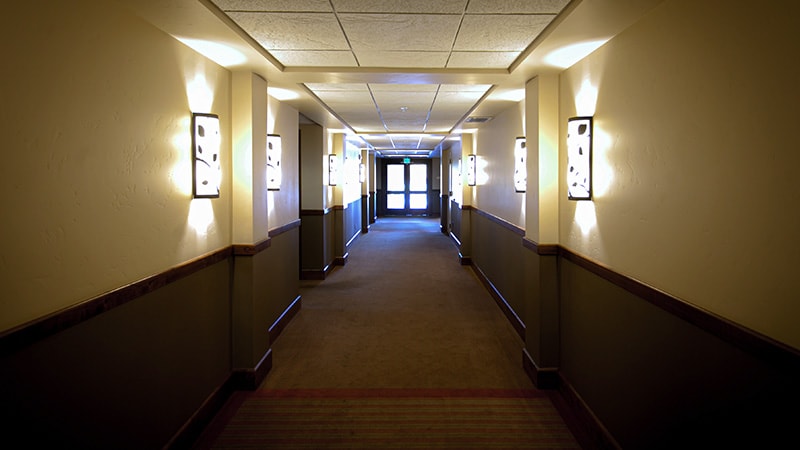Backup Lighting in Hotel Hallway Leading to an Exit