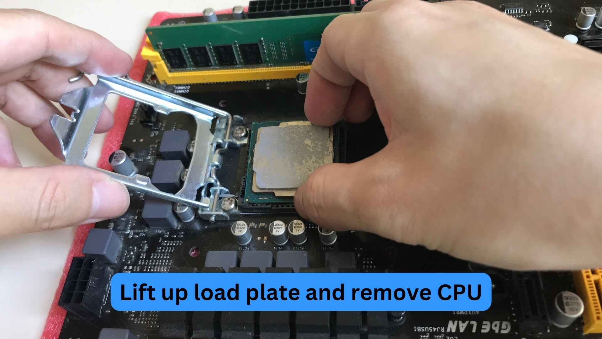Lift up the load plate and remove the CPU
