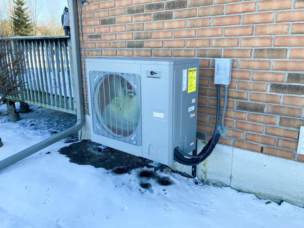 A heat pump outside in a Canadian winter. 