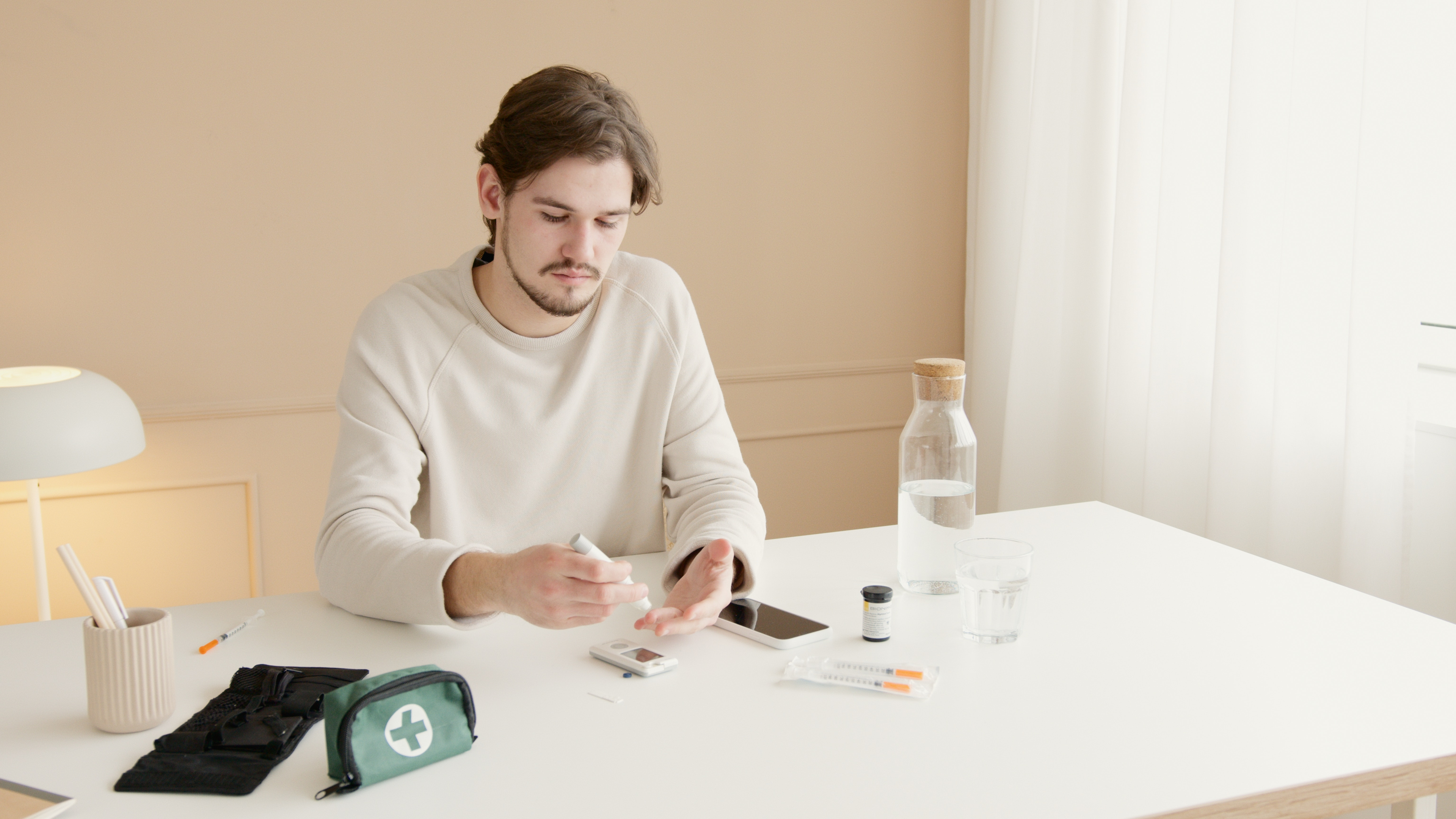 https://www.pexels.com/photo/a-man-checking-his-blood-sugar-level-using-a-glucometer-6823487/