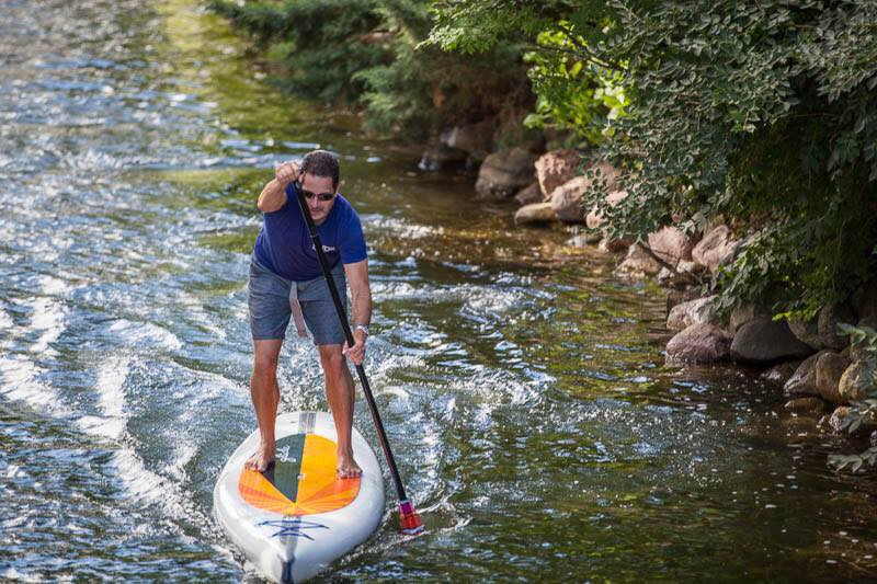 paddling a stand up paddle board