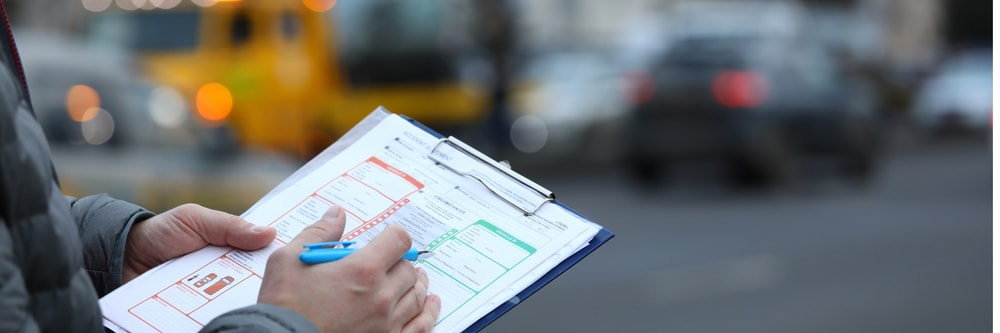 An image of a police officer filing a police report.
