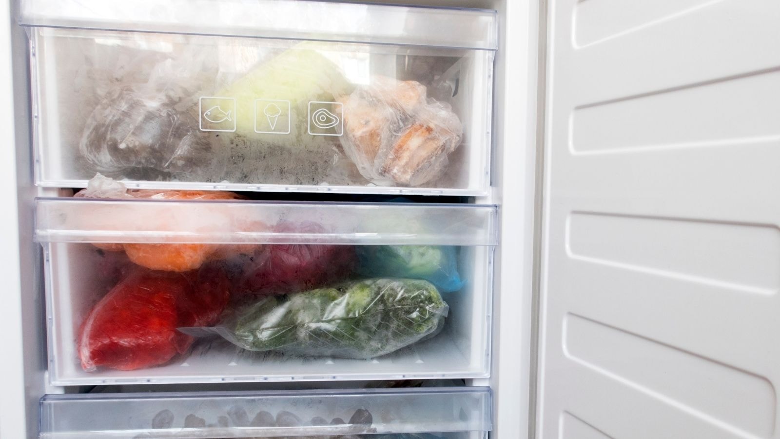 Frozen vegetables and herbs stored in freezer drawers