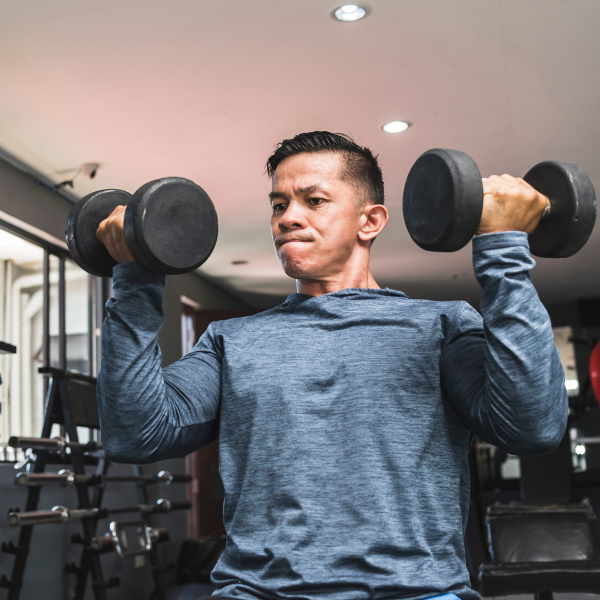 Image showing the proper form for an Arnold Press exercise.