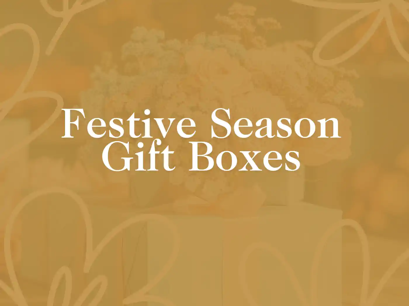 A table adorned with festive gift boxes, elegantly wrapped and topped with floral decorations, surrounded by cheerful lights, part of the Festive Season Gift Boxes Collection. Delivered with Heart by Fabulous Flowers and Gifts.