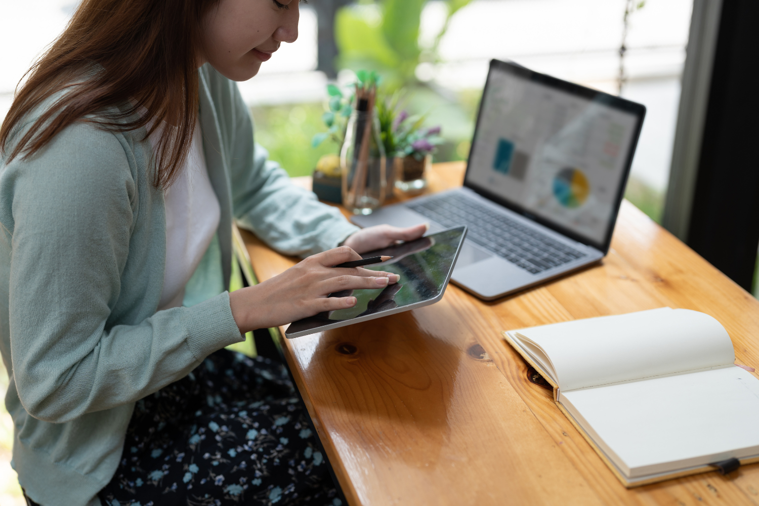 Woman with a laptop and a smartphone.