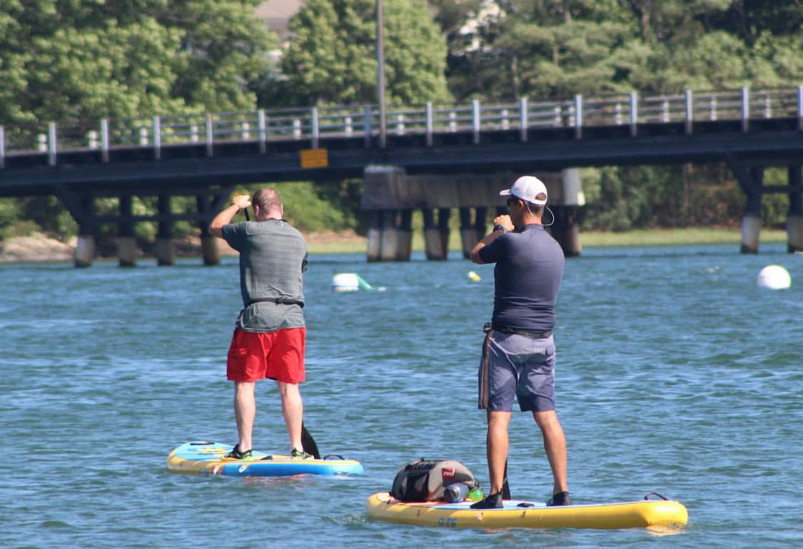 2 men on paddle boards