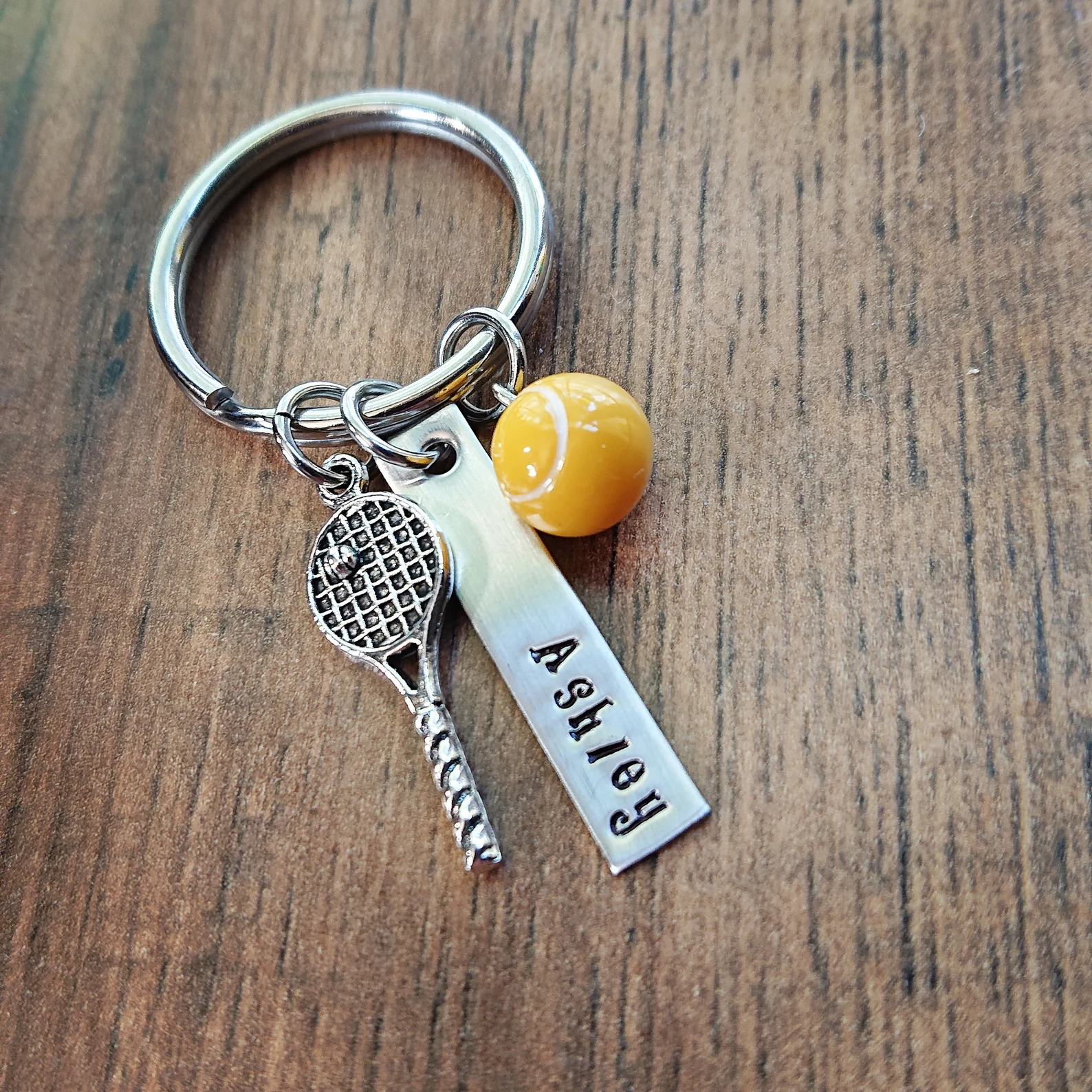 Your seniors will love and use this gorgeous tennis Keychain.