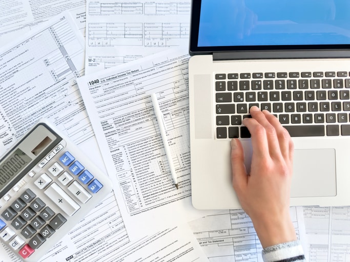 Aerial image of a self employed business owner working on corporation tax