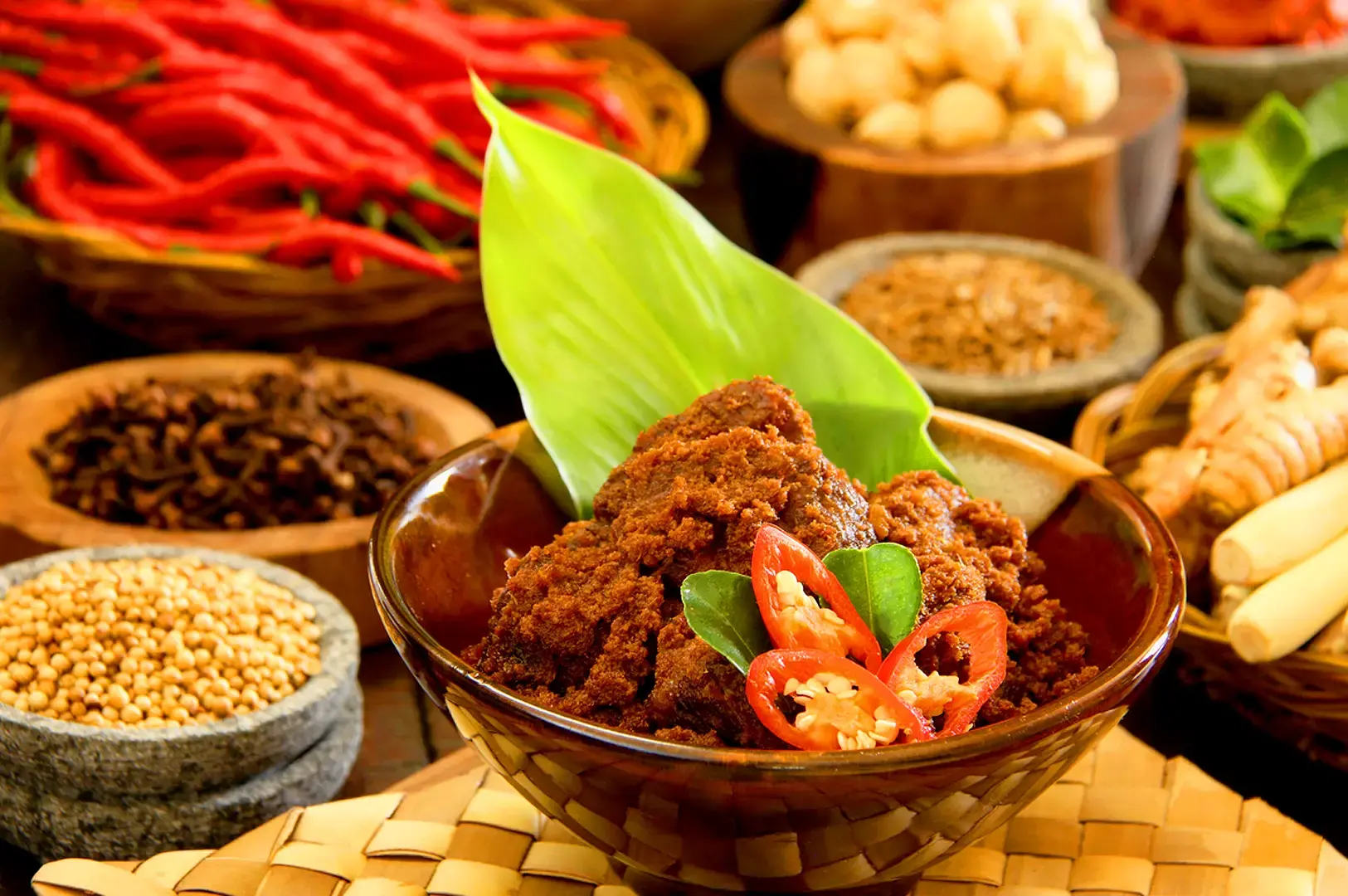 Indonesian spiced fried chicken served with traditional spices, chilies and aromatic herbs