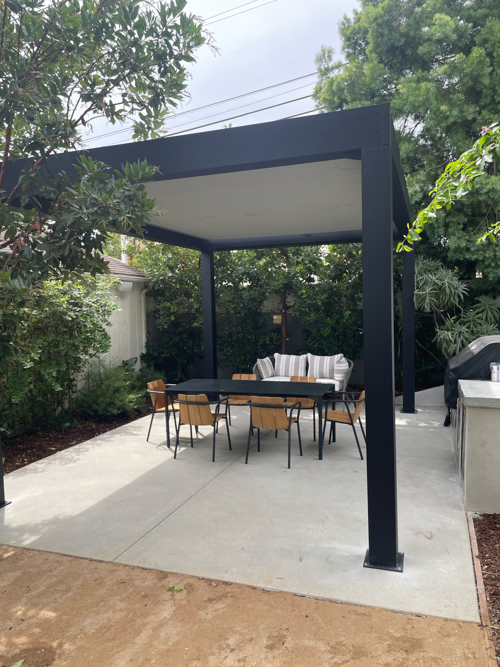Outdoor area with dining table and complete shade