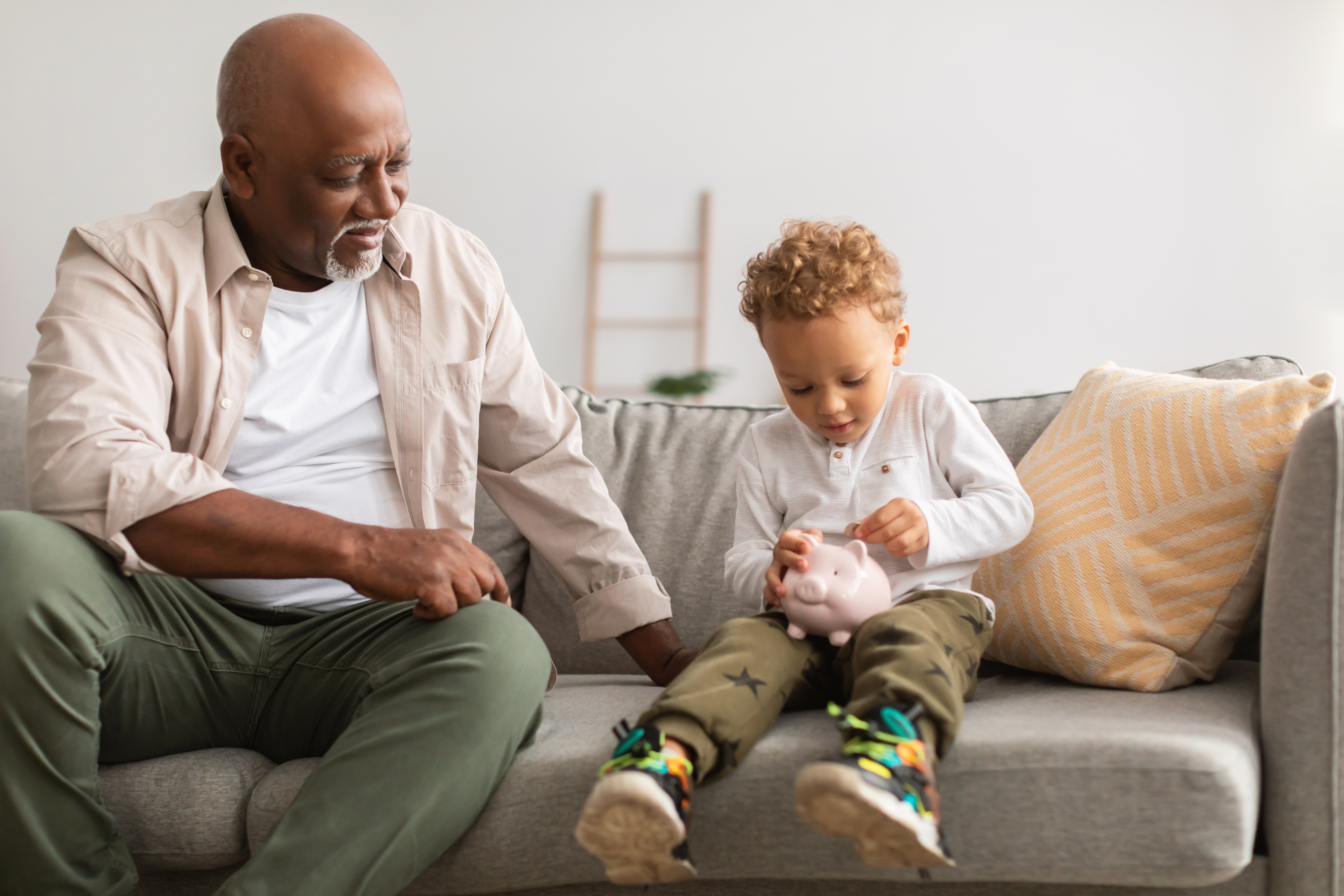 "From piggybank savings to secure futures: Grandpa and grandson ponder — is setting up a trust for the young one the next step?"