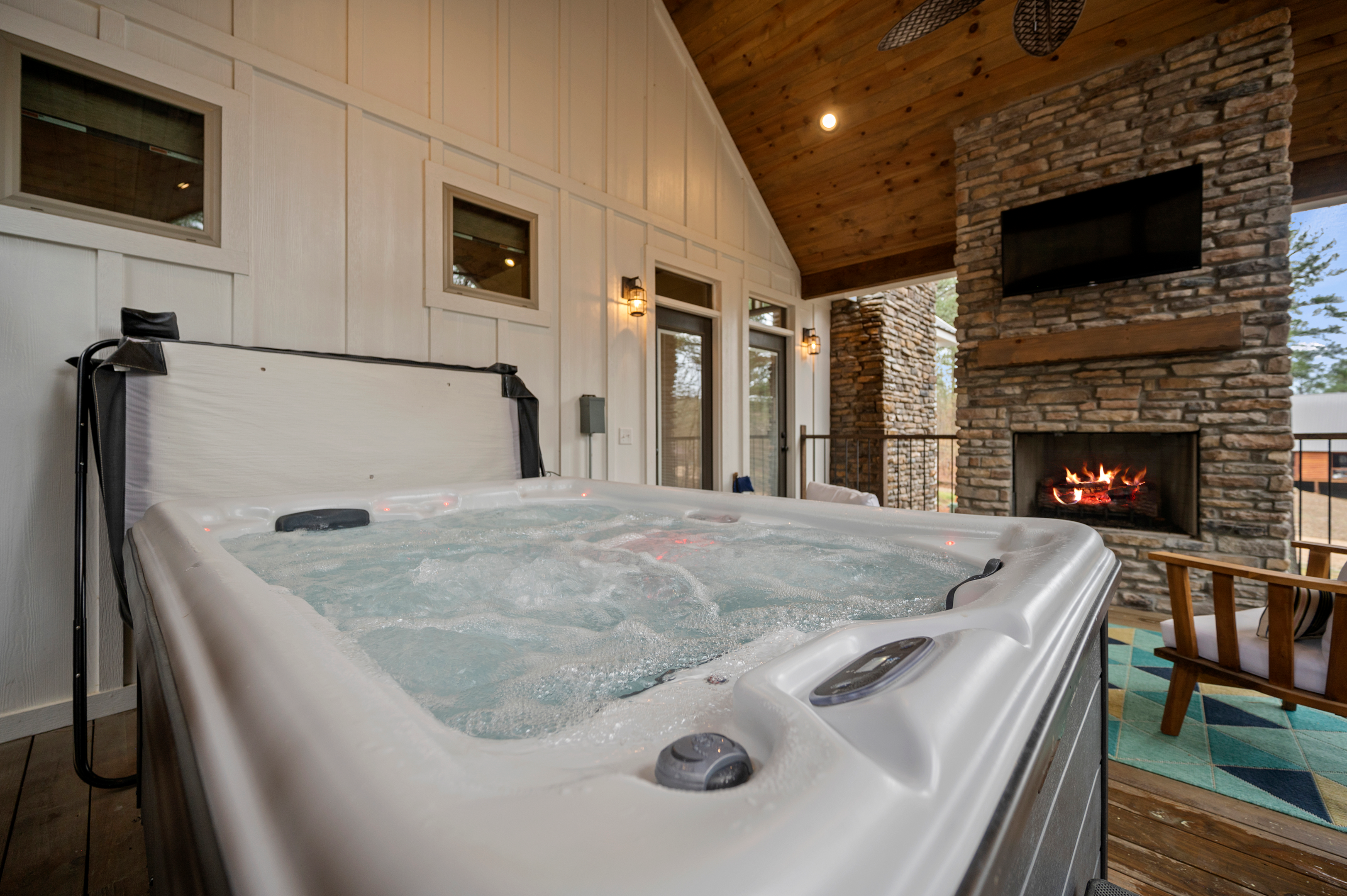 Lantern Hill Cabin by Little Pine Properties, relax in the hot tub while you stream your favorite shows. 