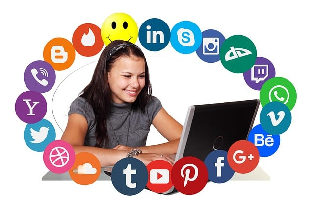 Social media manager smiling at laptop. Source: Surfer AI powered by Pixabay