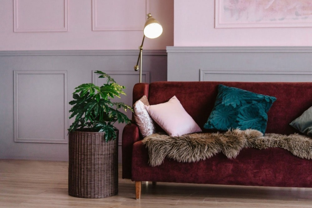Maroon sofa with pillows
