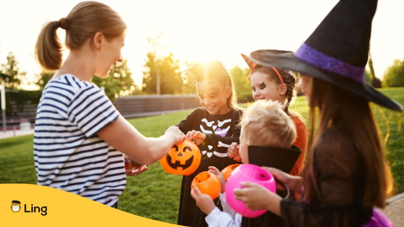 Group of kids trick or treating in park