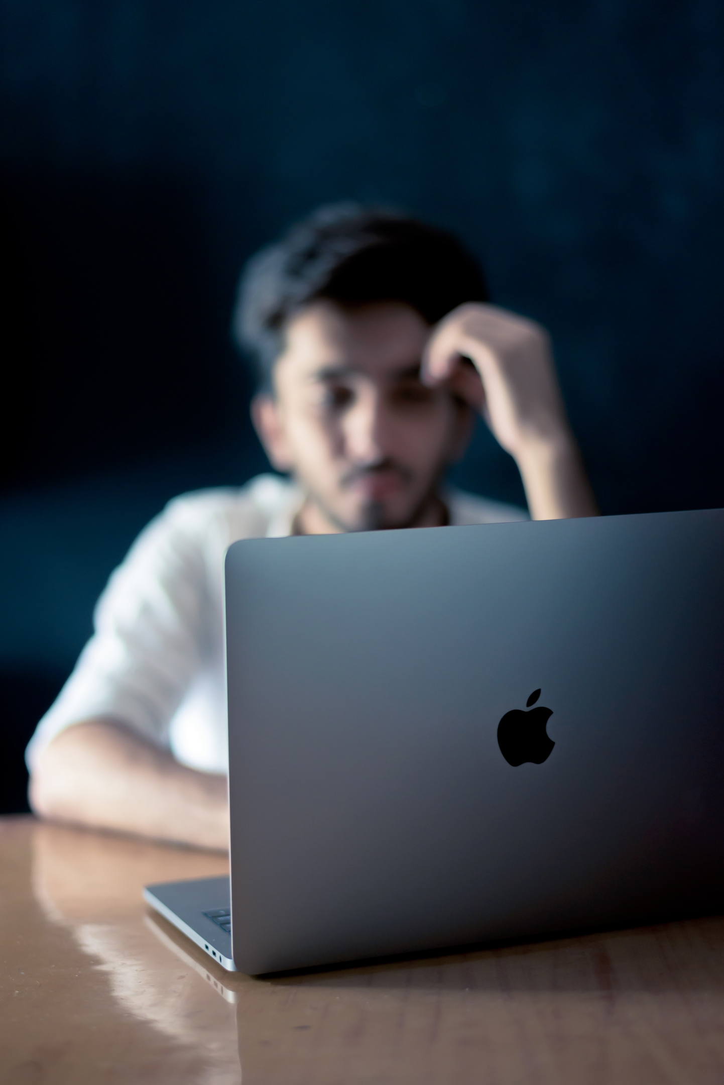 An image of a guy looking for something in his laptop