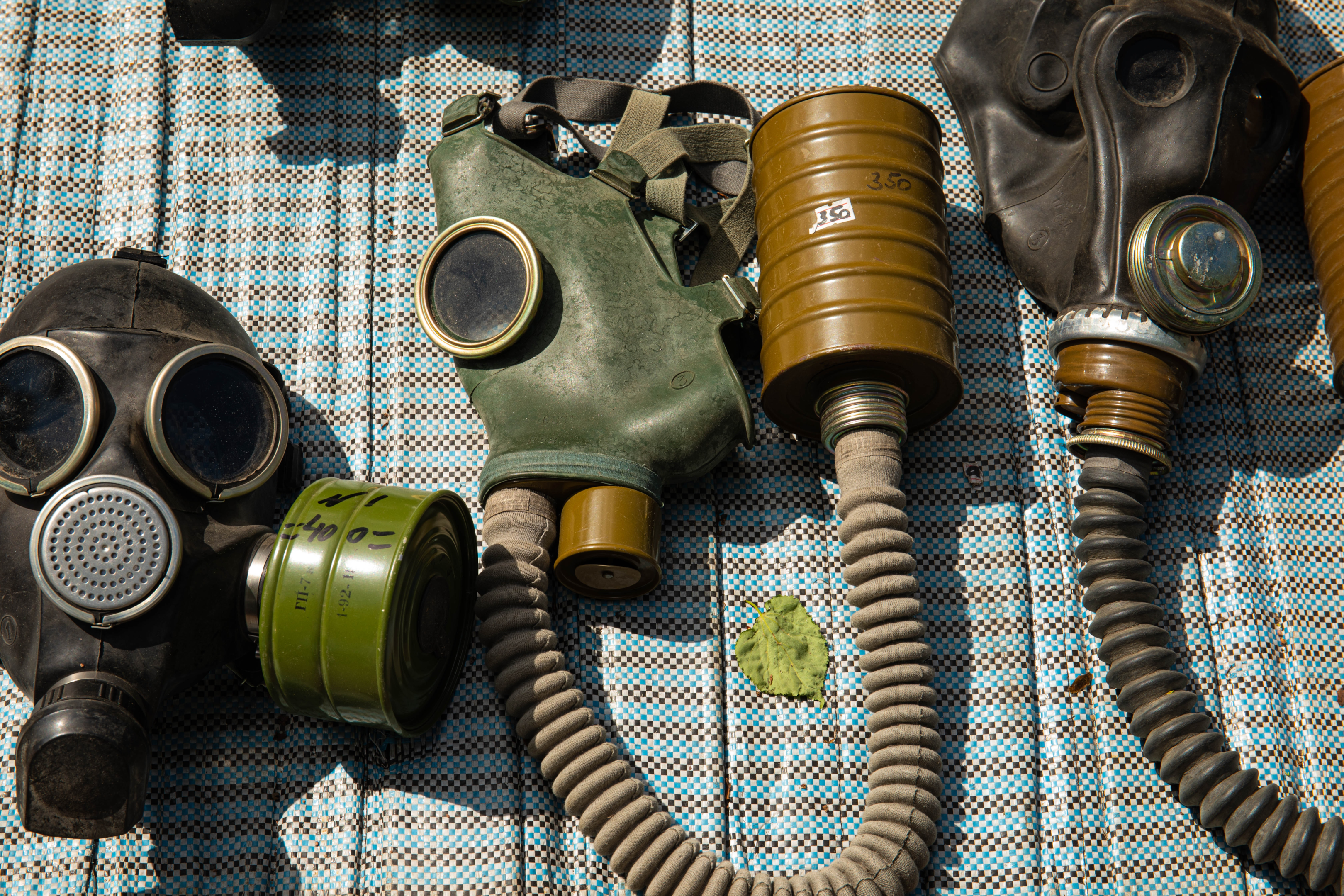 different gas mask types with breathing tubes