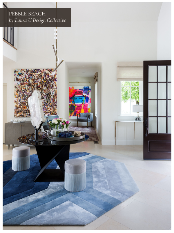 a plush blue rug encircles a table and two stools in an entryway design