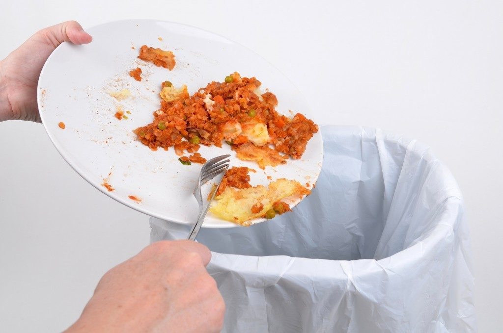Scrape off the dishes into the garbage disposal or trash