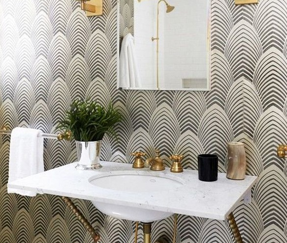 patterned wallpaper with sink and gold hardware