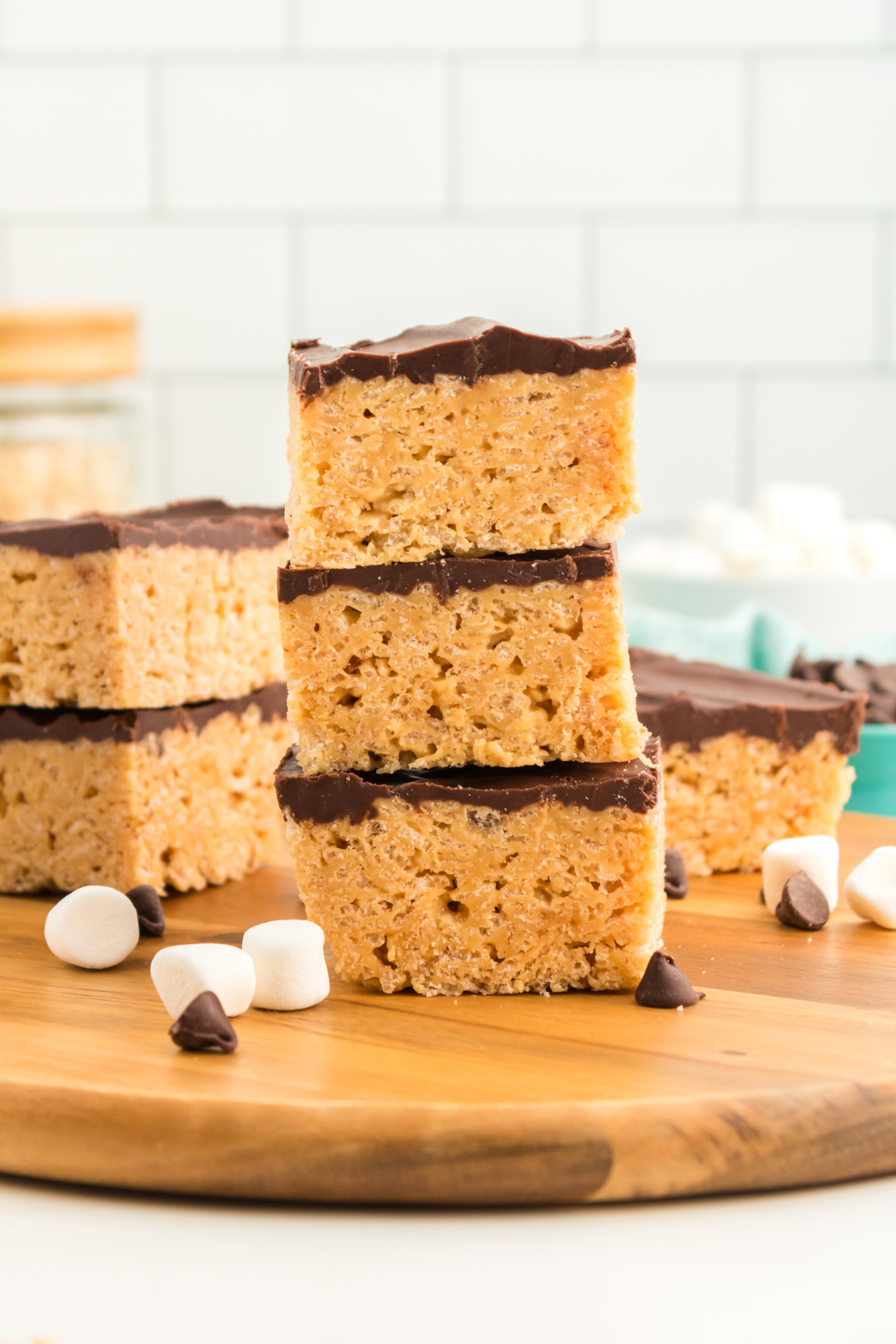three chocolate peanut butter rice krispie treats stacked on top of each other