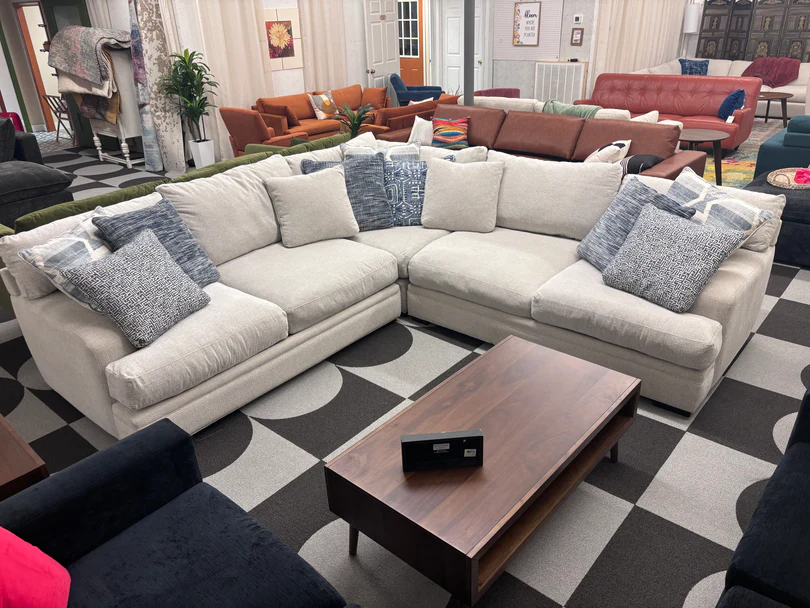 A stylish sectional sofa in a beautifully decorated living room.