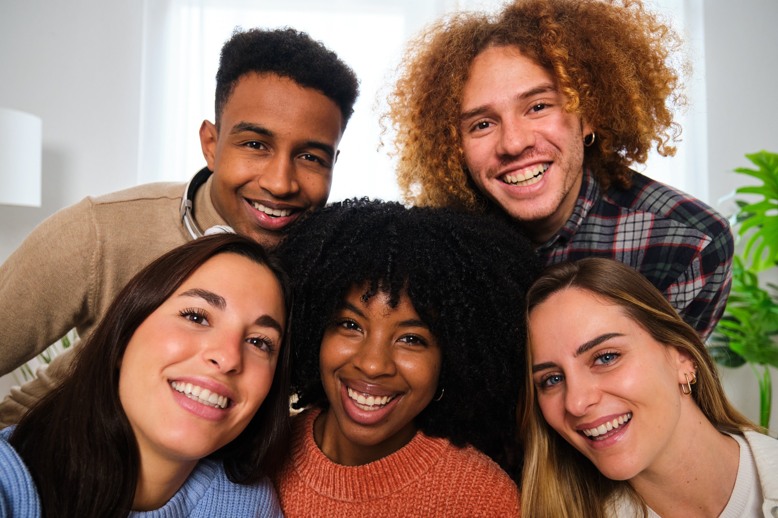 a group of smiling individuals who found South Calgary Oral Surgery for dental implants and many other services after searching for "dental implants calgary price"